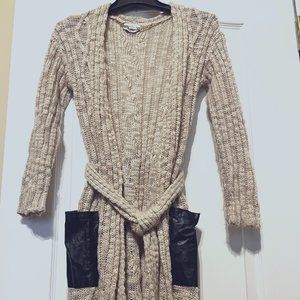 Bebe cardigan sweater with black faux leather pockets, belted tan an black gold